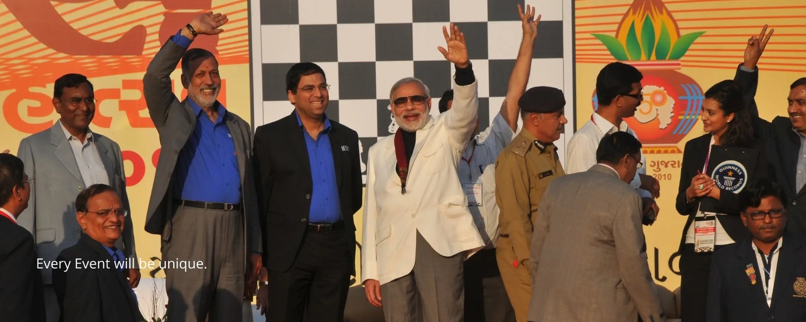 Elegant wedding setup with floral decorations and seating, white chairs and pastel flowers on tables, soft natural lighting, outdoor garden style