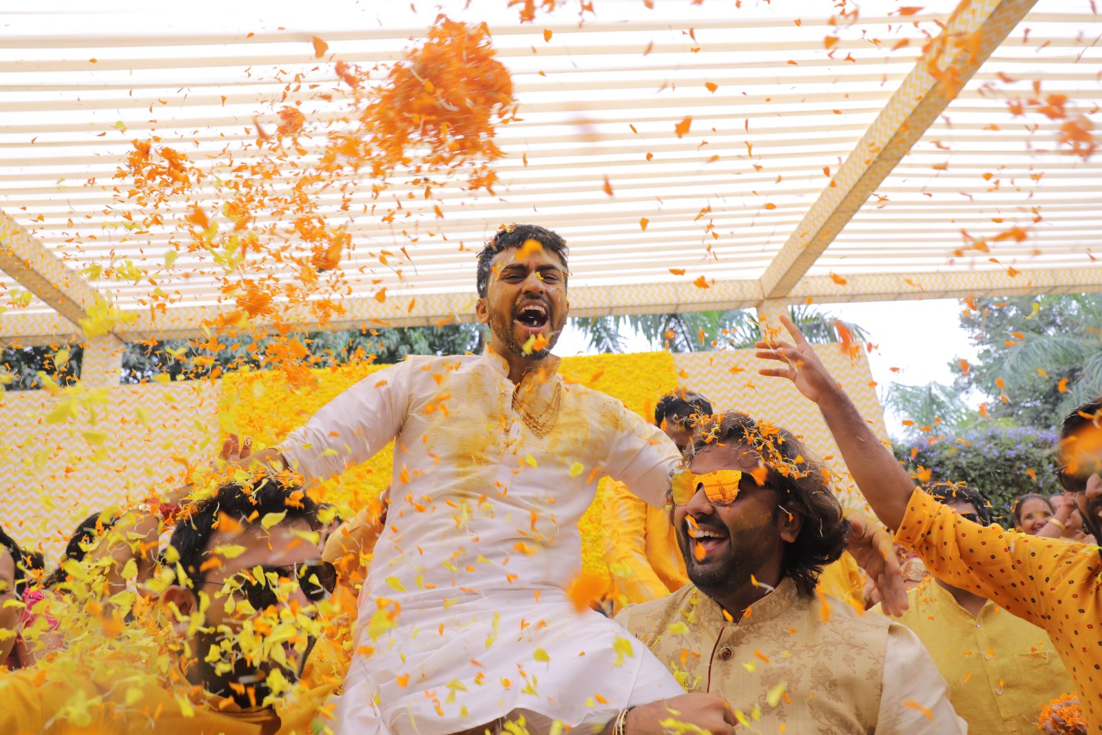 Annual Day event venue with red carpet and white pillars under blue sky